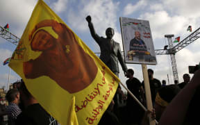 A photo taken earlier this month of protesters holding up portraits of Palestinian leader and prominent prisoner Marwan Barghouti.