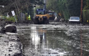 Mudslides unleashed by a ferocious storm demolished homes in southern California and killed at least 13 people, police said Tuesday.