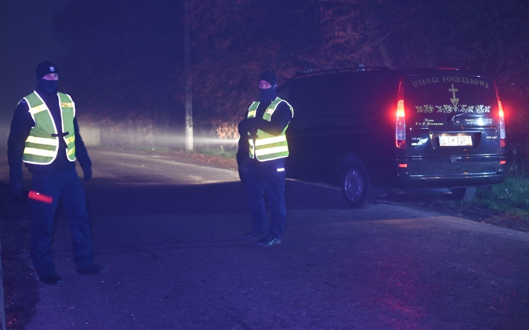 PRZEWODOW, POLAND - NOVEMBER 16: Police officers secure access to the site of the explosion in the village of Przewodow in the Lublin Voivodeship, on November 16, 2022 in Przewodow, Poland. At least two people were killed Tuesday in a suspected missile attack in eastern Poland not far from the Ukrainian border. Artur Widak / Anadolu Agency (Photo by Artur Widak / ANADOLU AGENCY / Anadolu Agency via AFP)