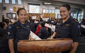 Petty Officers Emma Songivalu, left, and Junior Pahulu beat a drum at the first Royal New Zealand Navy Pacific Island Community Group forum at Devonport Naval Base.