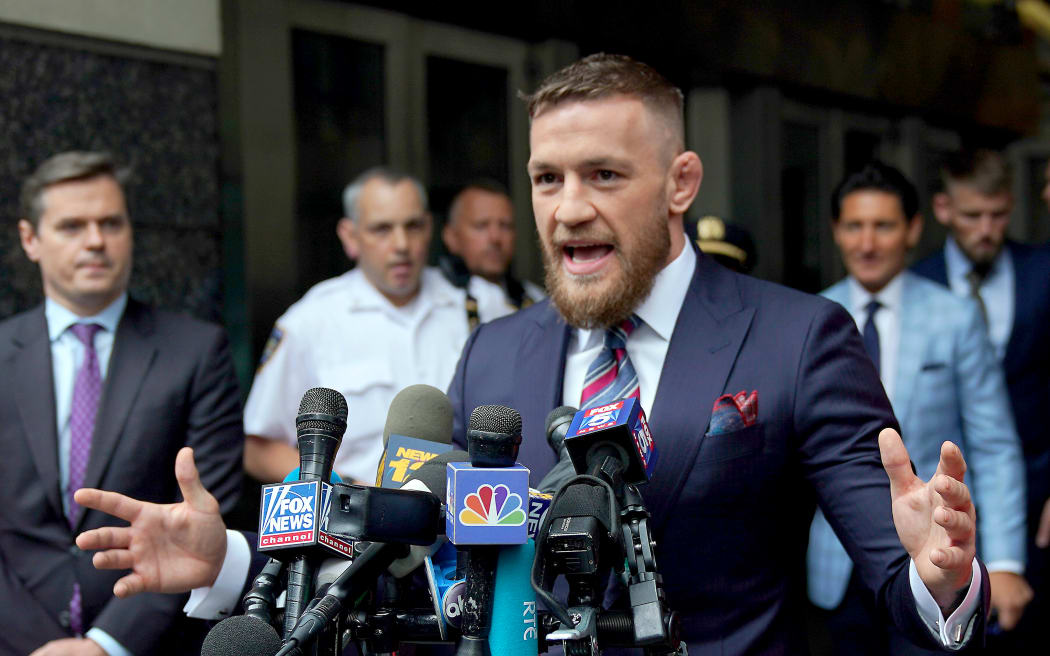 Conor McGregor talks to the press after he pleaded guilty to a single violation of disorderly conduct, in Brooklyn Criminal Court.