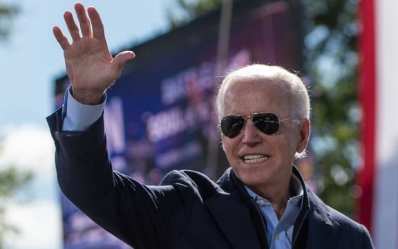 Democratic presidential nominee and former Vice President Joe Biden smiles as he acknowledges the crowd at the end of his speech at the Riverside High School in Durham, North Carolina during a campaign stop on October 18, 2020. (Photo by ROBERTO SCHMIDT / AFP)
