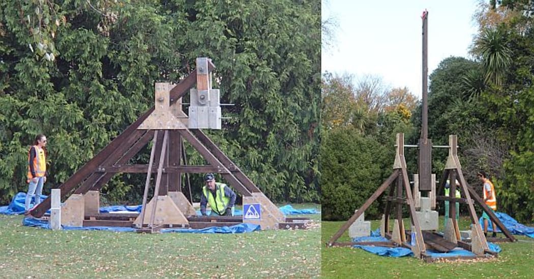The trebuchet, a 4-metre high medieval siege catapult, is in a cocked position ready to fire (left) and (right) the arm is extended vertically after it has fired and flung the ballistic.