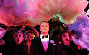 Craig McLachlan (C) plays the part of Billy Flynn during the final rehearsal of the hit musical 'Chicago' in Sydney on May 14, 2009. Known for its acclaimed score and sensational choreography, 'Chicago' is a story of murder, greed, corruption, exploitation, adultery and treachery.