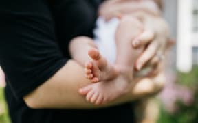 Woman breastfeeding baby.