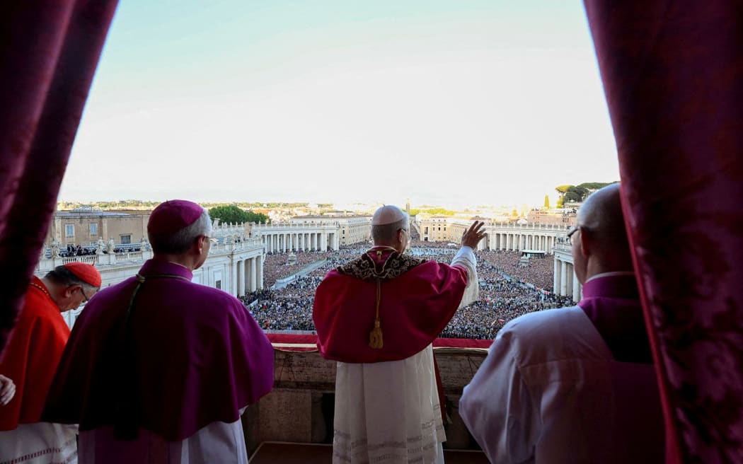 The newly elected Pope Leo waves from the balcony of St. Peter's Basilica on Thursday.