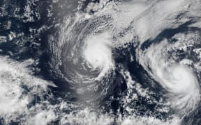 NASA Rarth Observatory image shows on August 5, both Iselle (L) and Hurricane Julio (R) en route to Hawaii.