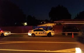 Police guard the scene in Mangere, South Auckland, where a toddler was found dead.