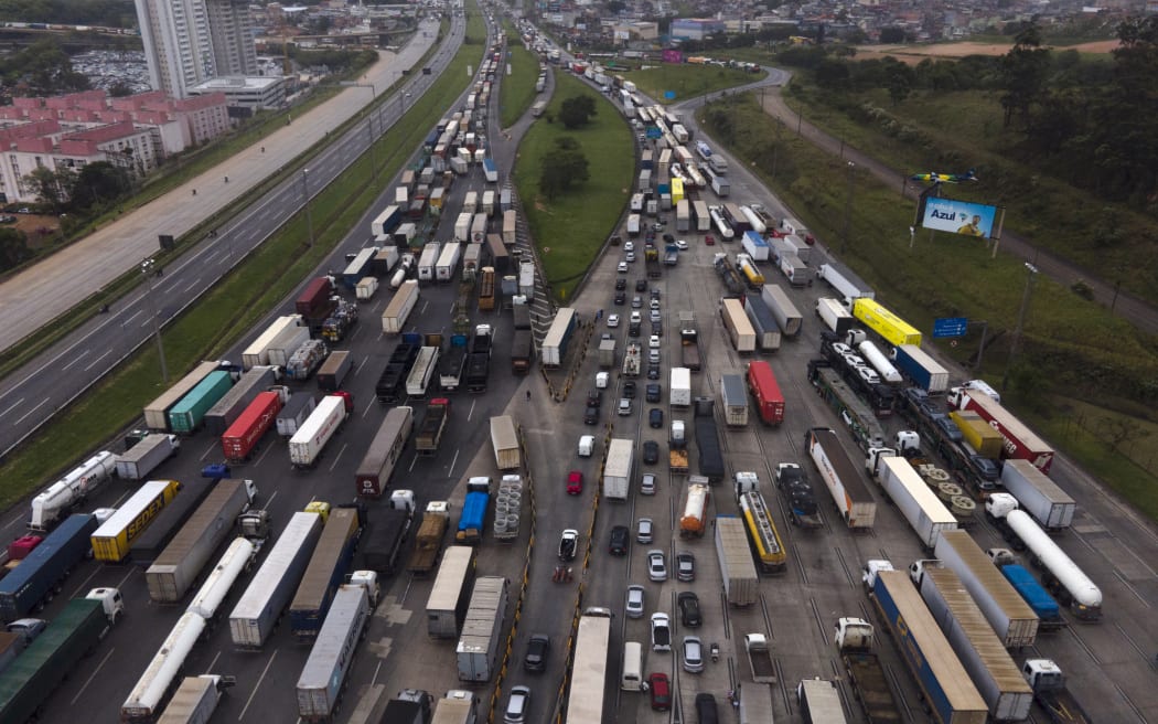 Truck drivers and other supporters of President Jair Bolsonaro block Castelo Branco Highway on the outskirts of Sao Paulo, Brazil, on November 1, 2022.