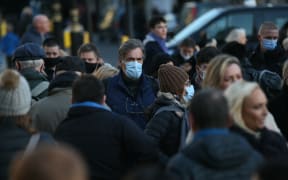 People wear face masks on streets after Omicron variant cases of Covid-19 rises to 160 in London, United Kingdom on December 04, 2021