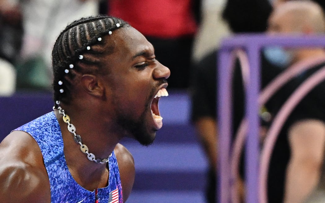Noah Lyles celebrates after winning the men's 100m final at the Paris Olympics.