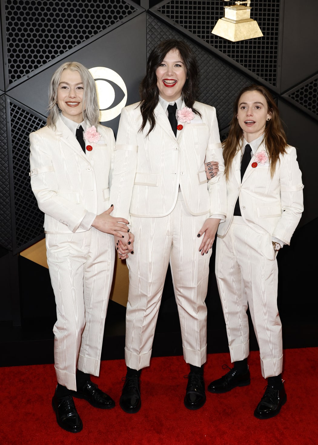 LOS ANGELES, CALIFORNIA - FEBRUARY 04: (FOR EDITORIAL USE ONLY) (L-R) Phoebe Bridgers, Lucy Dacus, and Julien Baker of 'boygenius' attend the 66th GRAMMY Awards at Crypto.com Arena on February 04, 2024 in Los Angeles, California.   Frazer Harrison/Getty Images/AFP (Photo by Frazer Harrison / GETTY IMAGES NORTH AMERICA / Getty Images via AFP)