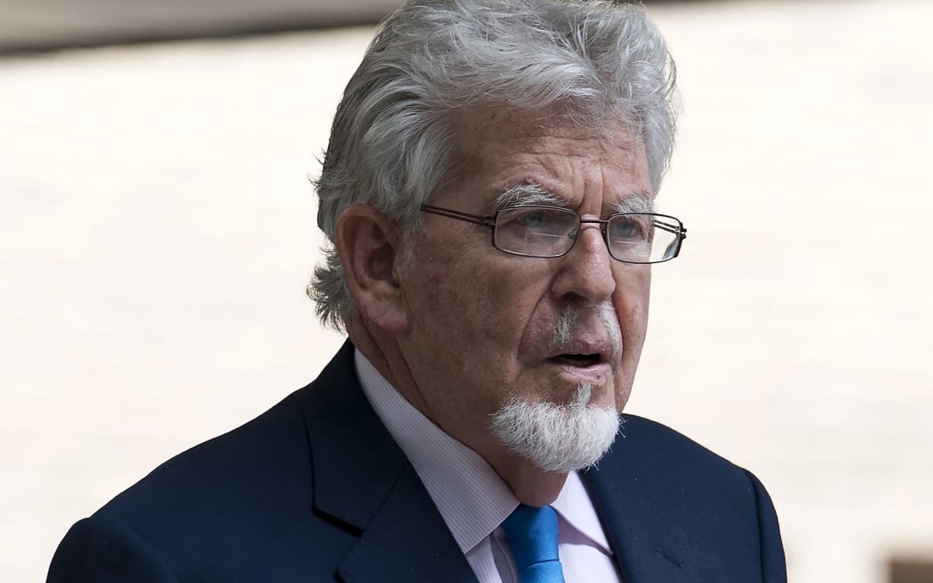Australian entertainer Rolf Harris leaves Southwark Crown Court in London on May 30, 2017. Harris had been accused of four counts of indecent assault against three teenage girls between 1971 and 1983. He was found not guilty of the charges, with prosecutors saying they would not seek a retrial. (Photo by Justin TALLIS / AFP)