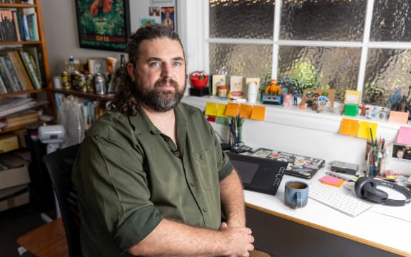 Portrait of Toby at his desk.