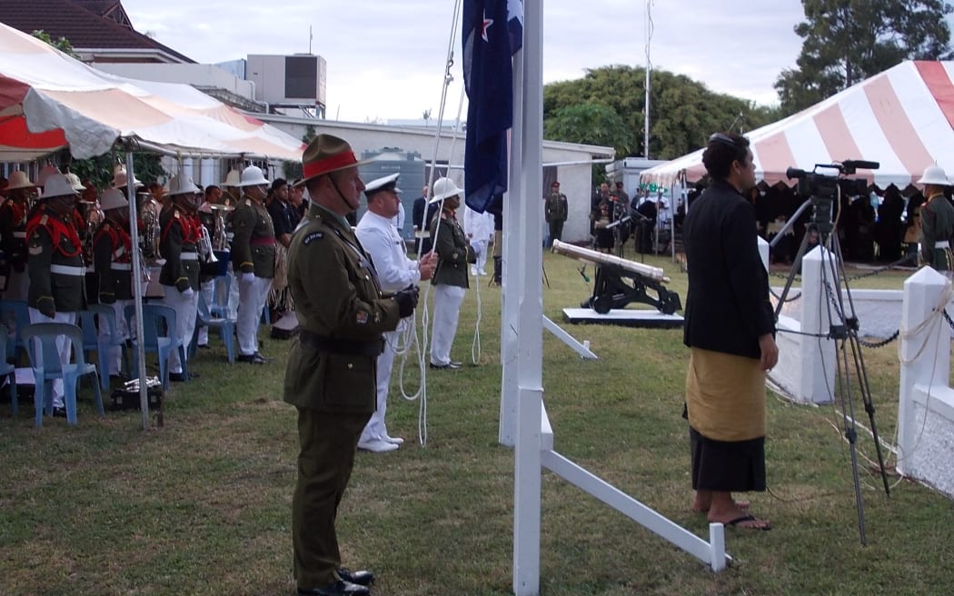 Warrant officer Roger Middleton raises the NZ Flag during the Nuku'alofa dawn service.