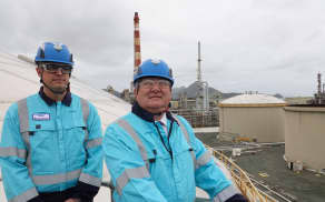 Channel Infrastructure chief executive Rob Buchanan and Regional Development Minister Shane Jones atop a 30-million-litre jet fuel tank.
