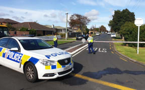 Police at Central Avenue in Papatoetoe after a man wielding a machete was shot dead.