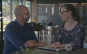 Sustainable New Zealand Party leader Vernon Tava talking to a woman portrayed as a supporter named Jill, but who is actually an actor.