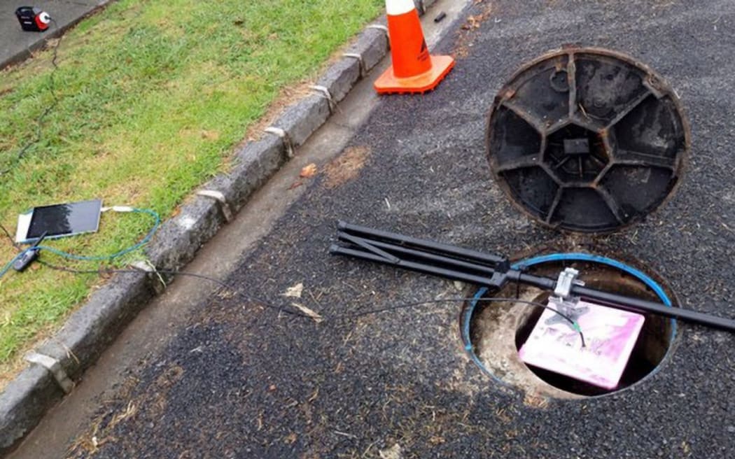 Setting up the test in a stormwater utility hole.
