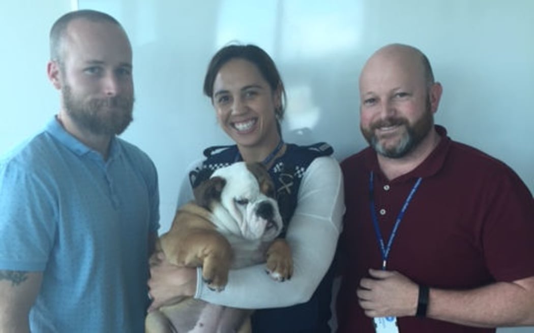 Constable Tim Harnett, left, Constable Natalie Heem and Detective Shayne Precious from Counties Manukau police with Alleycat.