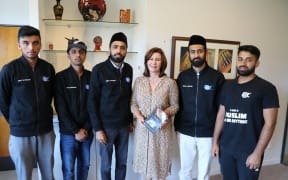 Mustenser Qamar (second to right) and his associates with Nelson mayor Rachel Reese, centre.