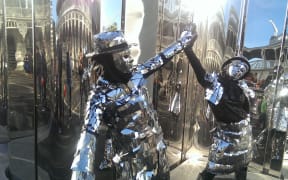 Mirror folk entertain the public at the opening of the Len Lye Centre in New Plymouth.