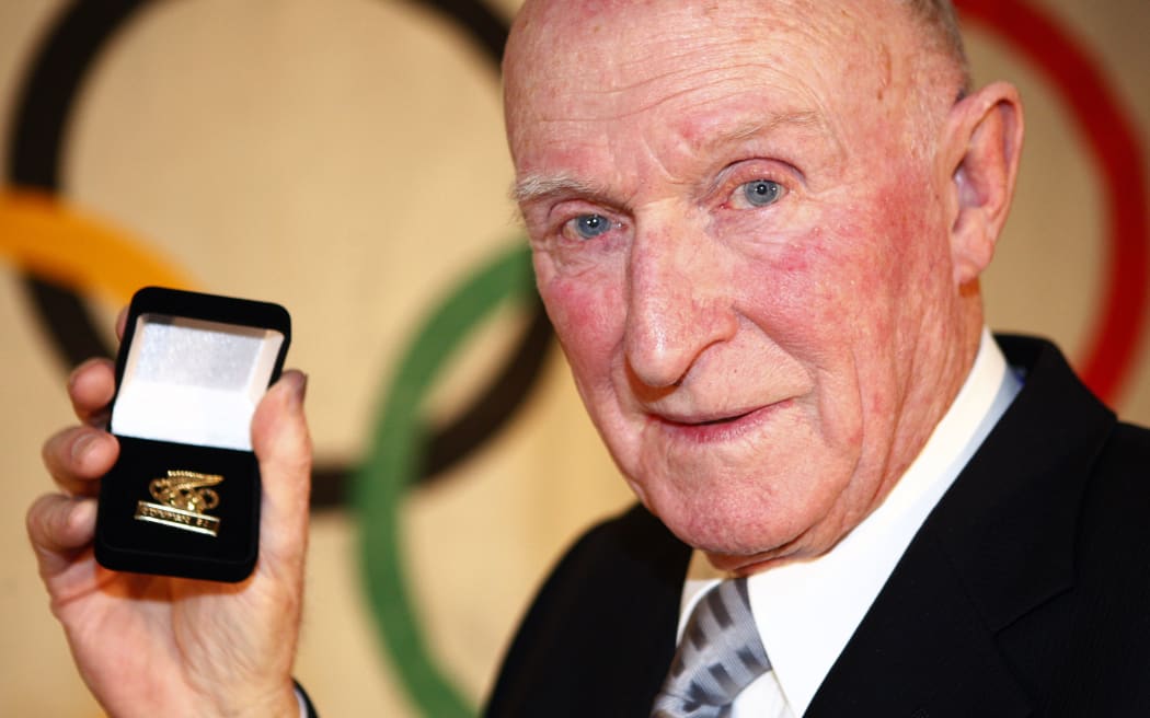 Sir Murray Halberg. Auckland Central Olympic Function to celebrate 100 years of New Zealand participation in the Olympic Games in 2009. All former Olympic athletes recieved a badge of recognition from the NZ Olympic Commitee.