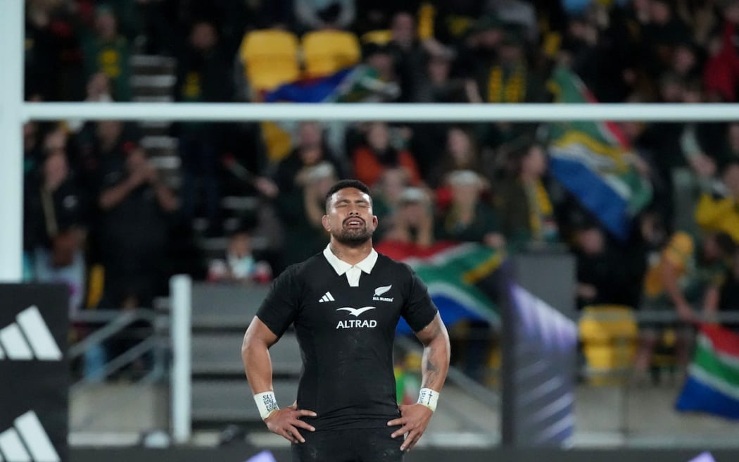 All Black Ardie Savea stands dejected.