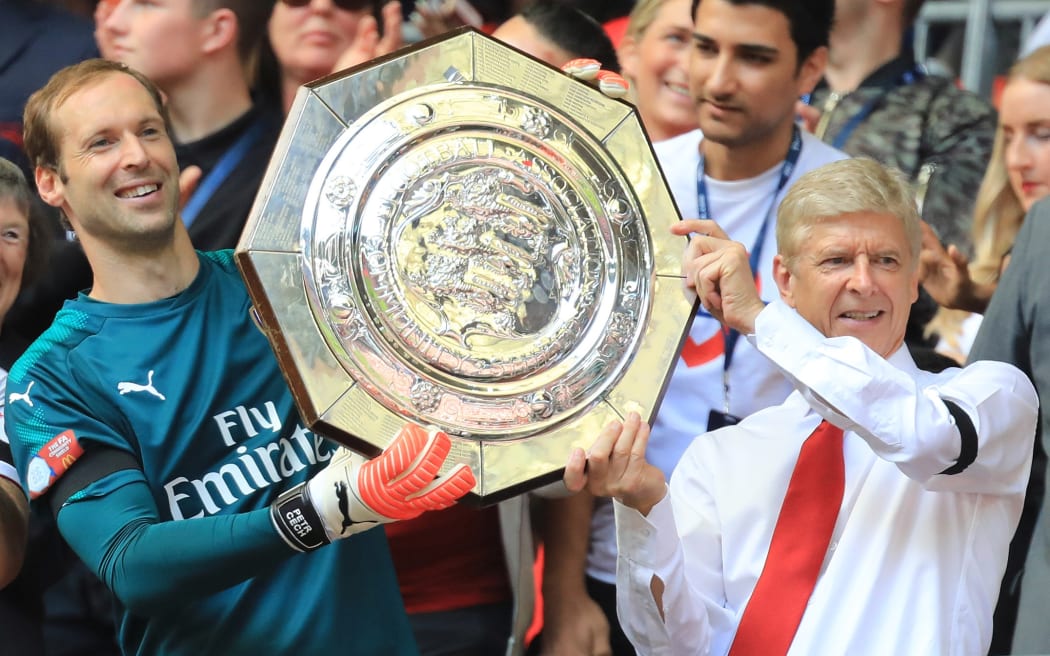 Arsene Wenger (right) and goalkeeper Petr Cech after winning the FA Charity Shield against Chelsea last year.