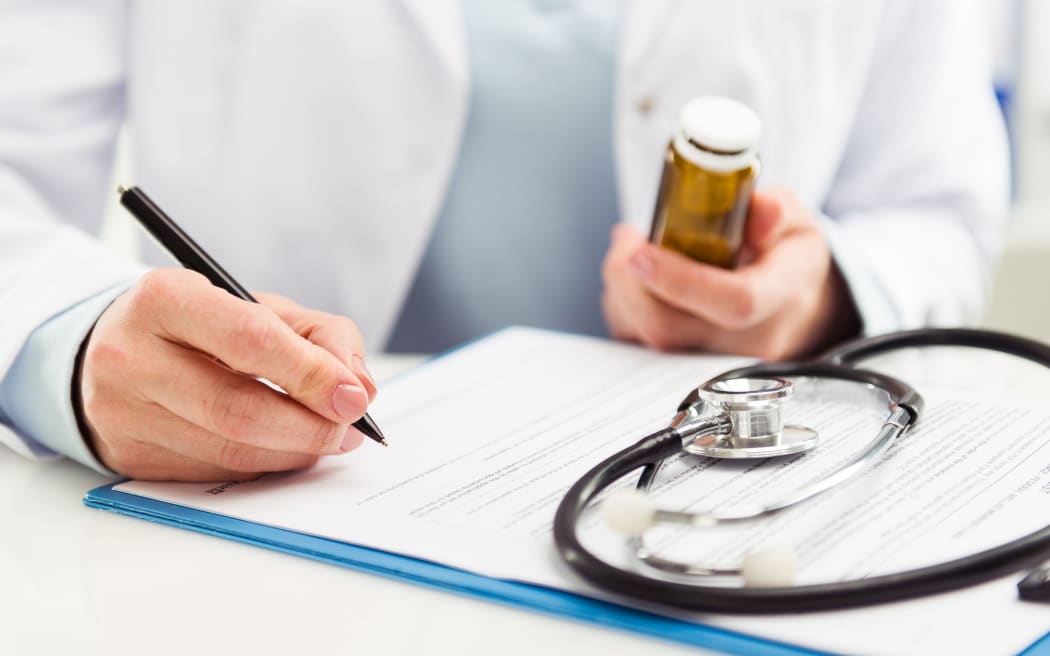 Doctor prescribing pills