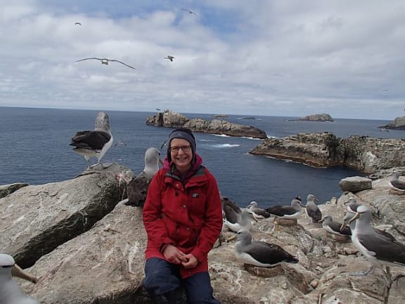 Our Changing World producer Alison Ballance, on Proclamation Island in the Bounty Islands group, with Salvin's albatrosses.