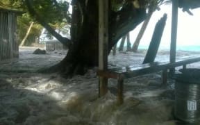 Tuvalu - waves going through a local home
