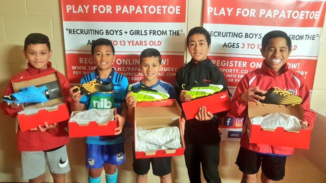 Papatoetoe RFC junior players receive new boots for the rugby season.