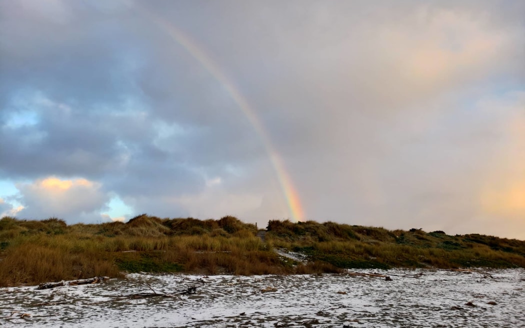 A rainbow above a snow-sprinkled New Brighton beach, Christchurch, Tuesday 6 September 2022.