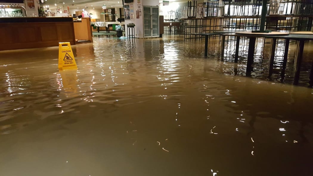 Floodwaters cover the floor of the Petone Working Men's Club.