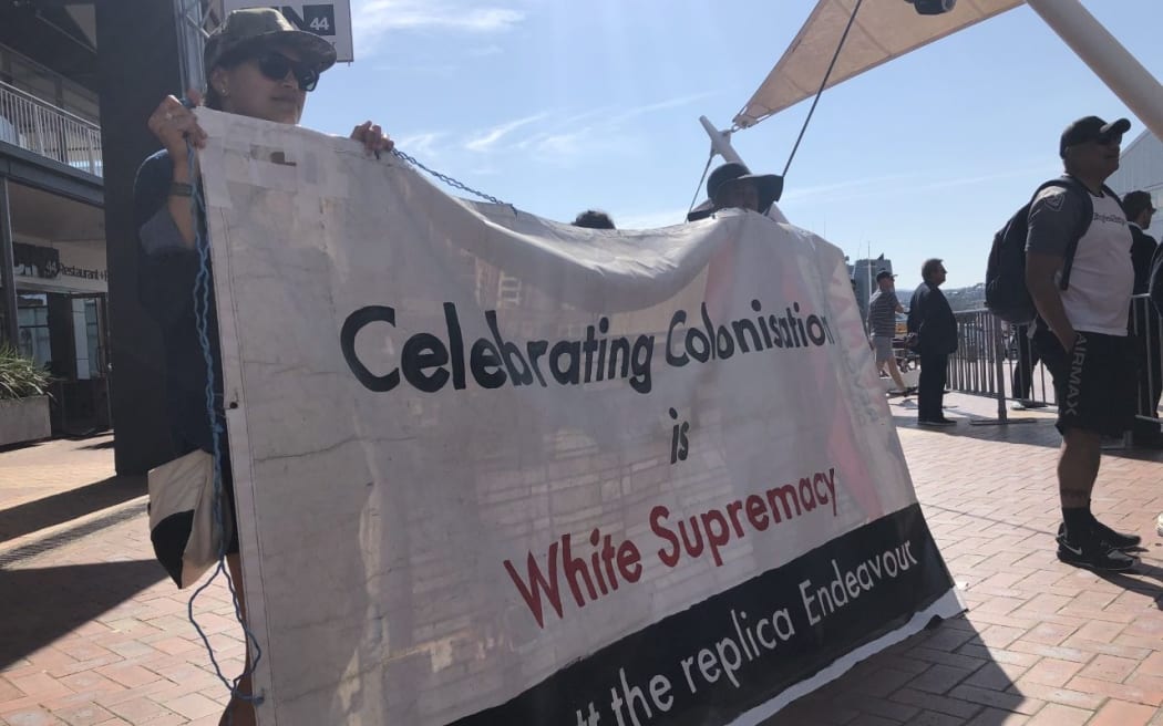 Protesters have disrupted the Wellington event in the Tuia 250 commemorations, calling for a boycott of the replica Endeavour ship.
