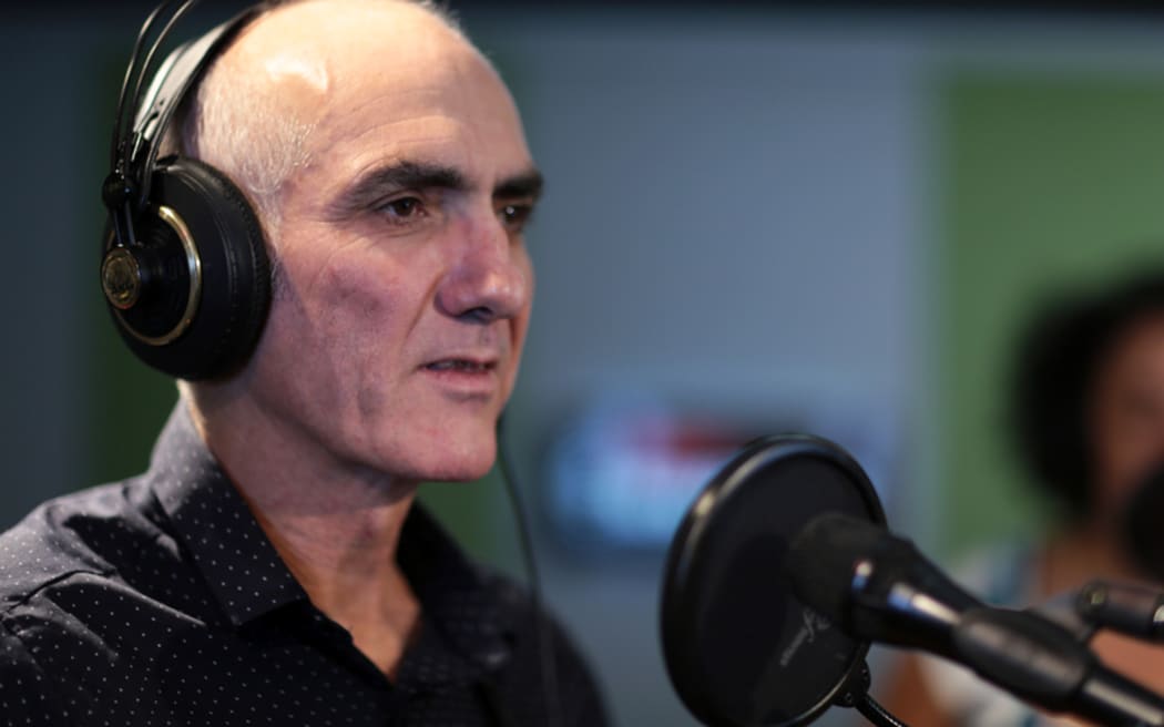 Singer-songwriter Paul Kelly performing at RNZ