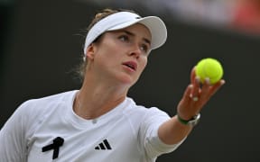 Ukraine's Elina Svitolina returns against China's Wang Xinyu during their women's singles fourth round tennis match on the eighth day of the 2024 Wimbledon Championships at The All England Lawn Tennis and Croquet Club in Wimbledon, southwest London, on July 8, 2024. Svitolina won the match 6-2, 6-1. (Photo by ANDREJ ISAKOVIC / AFP) / RESTRICTED TO EDITORIAL USE