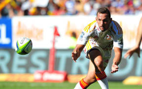 Aaron Cruden has eyes only for the ball