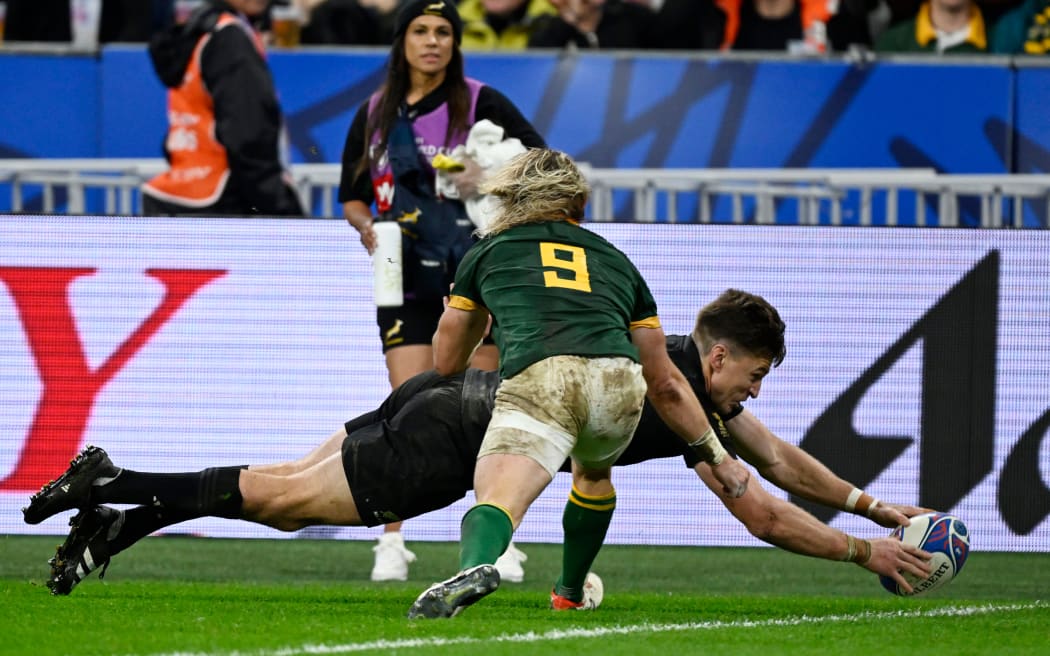 Beauden Barrett dives to score a try for the All Blacks in the Rugby World Cup 2023 final between New Zealand and South Africa at Stade de France.