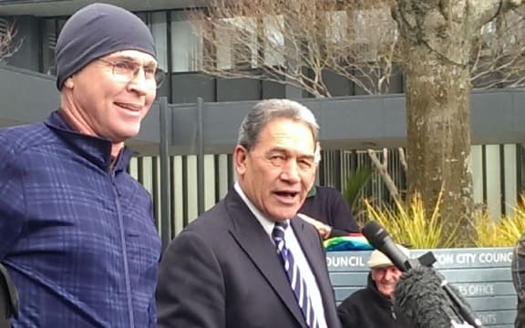 Winston Peters, right, and the heckler traded insults.
