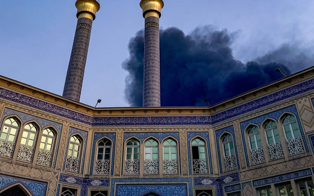 Smoke rises after an explosion occurred in downtown Tehran amid the third day of Israel's military strikes against Iran, Sunday, June 15, 2025. (Photo by Khoshiran / Middle East Images via AFP)