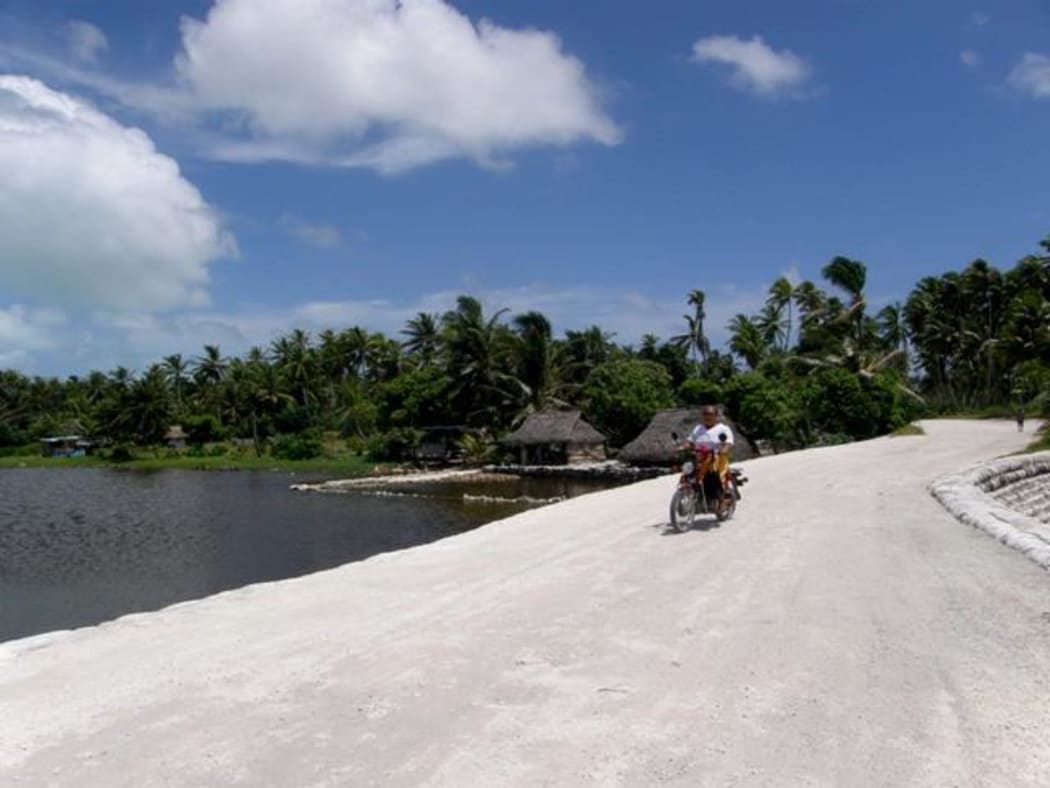 Scooter at shoreline Kiribati