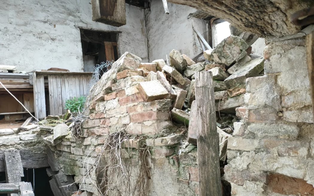 The houses (like this one, which has already sold) are in various states of abandonment.