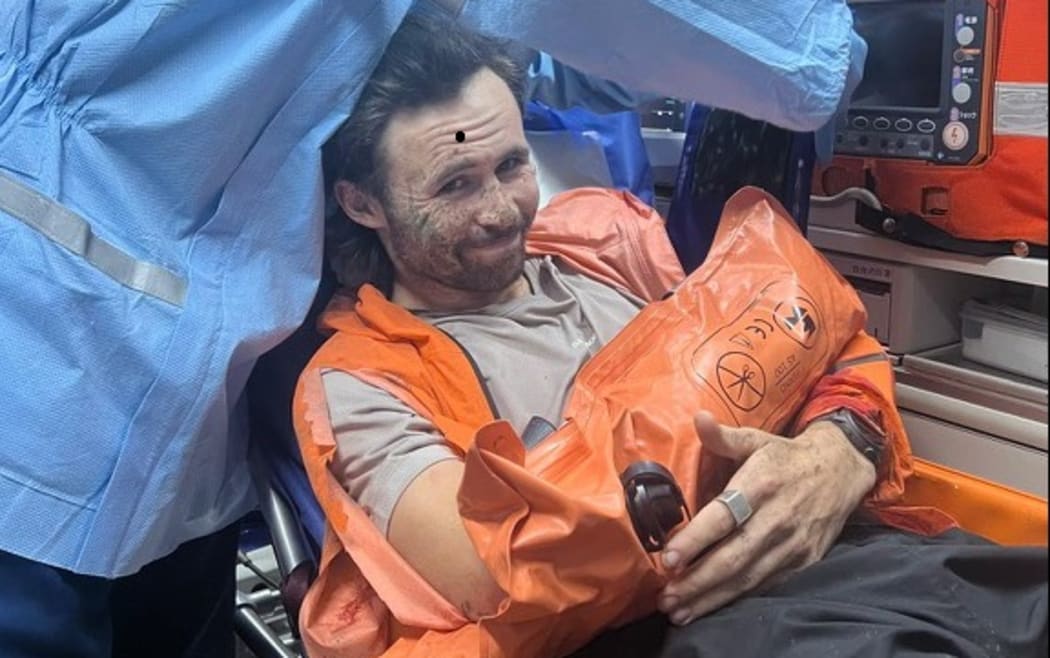 Billy Halloran on his way to hospital after the bear attack, along with an x-ray of his broken arm.