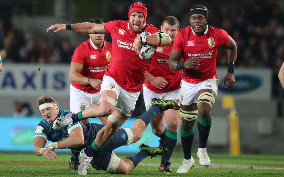 Lions flanker James Haskell breaks the tackle of Blues flanker Blake Gibson during the Blues vs British and Irish Lions match in 2017.