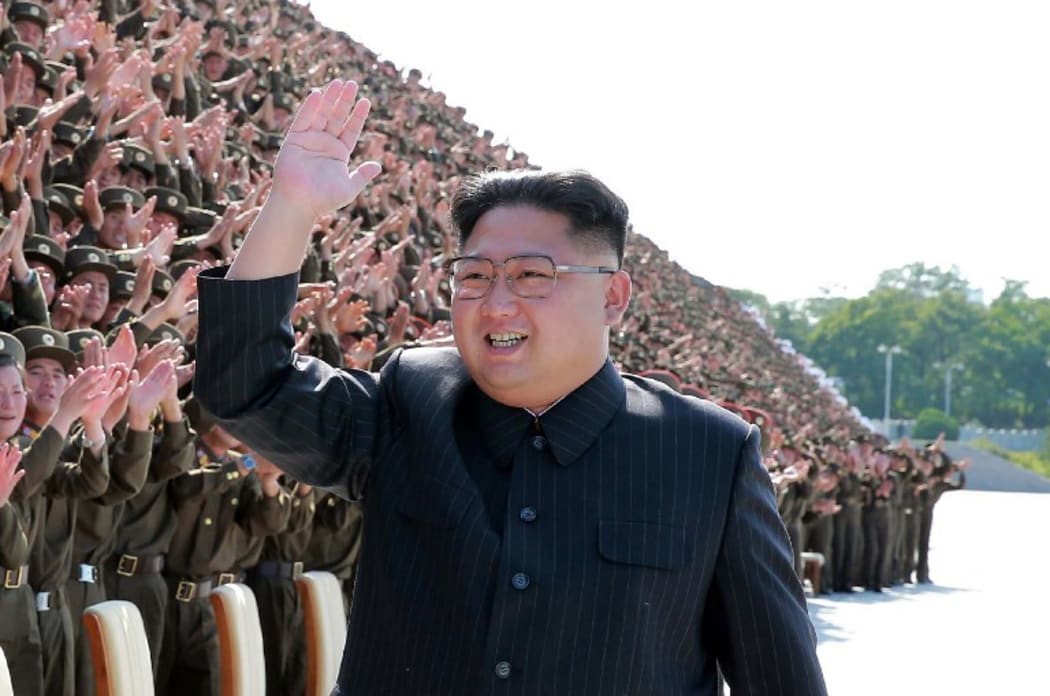 An undated picture released by North Korea's news agency shows leader Kim Jong-Un attending a photo session.