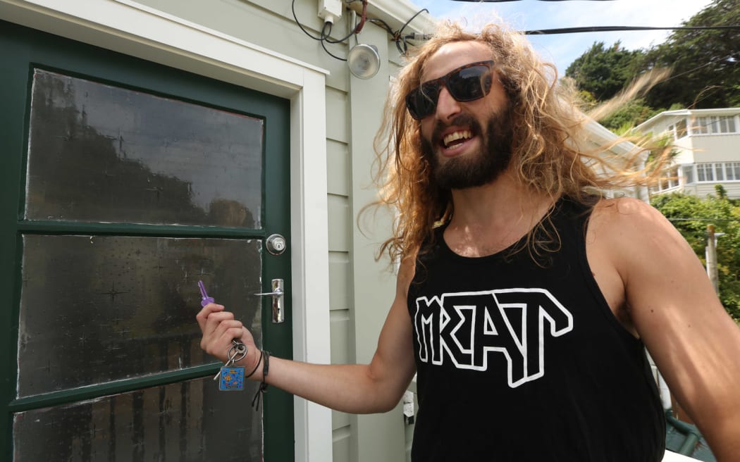 William Odey with the key to his new flat.