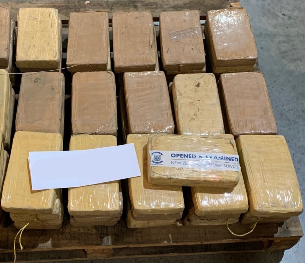 Packages of seized cocaine found in a shipping container from South America.