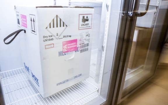 A box containing a shipment of the Pfizer-BioNTech Covid-19 vaccine sits in a freezer at a Colorado medical centre.